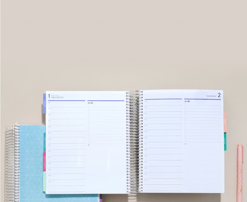 two coiled daily lifeplanner duos with colorful accessories.
